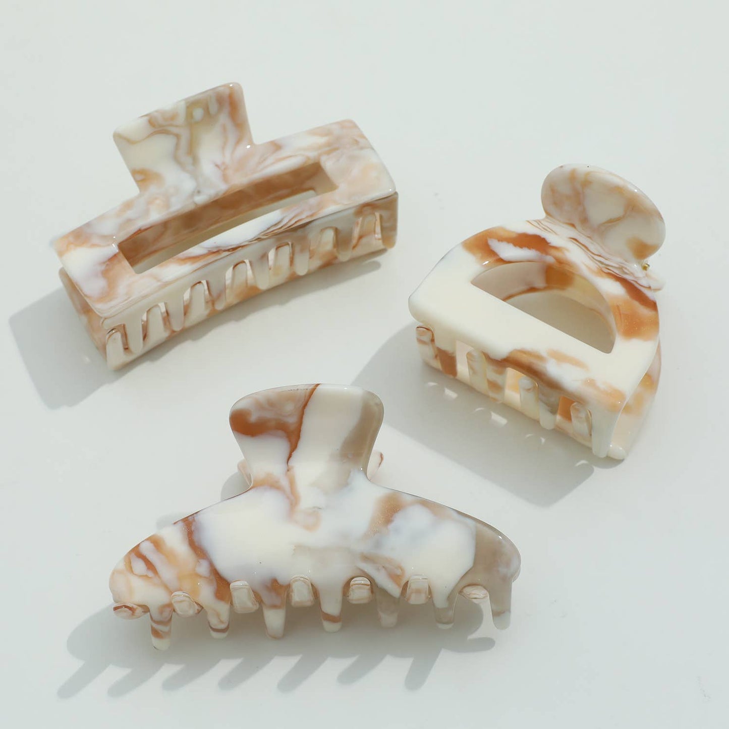 THE CALACATTA GOLD CLAW CLIPS