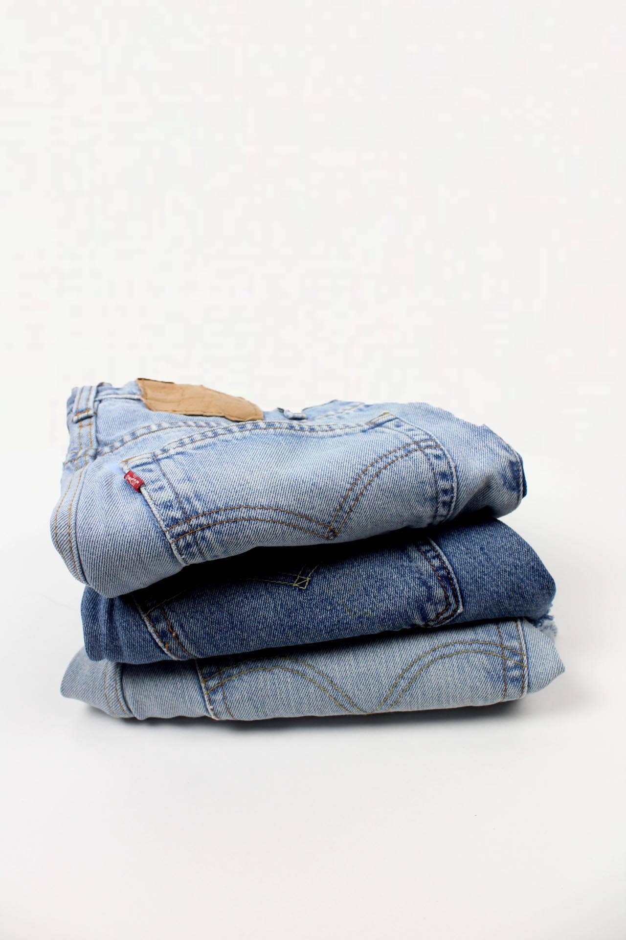 THE HIGH-RISE UPCYCLED DENIM CUTOFFS