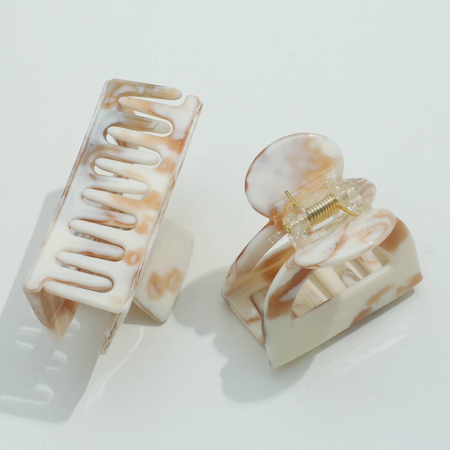THE CALACATTA GOLD CLAW CLIPS